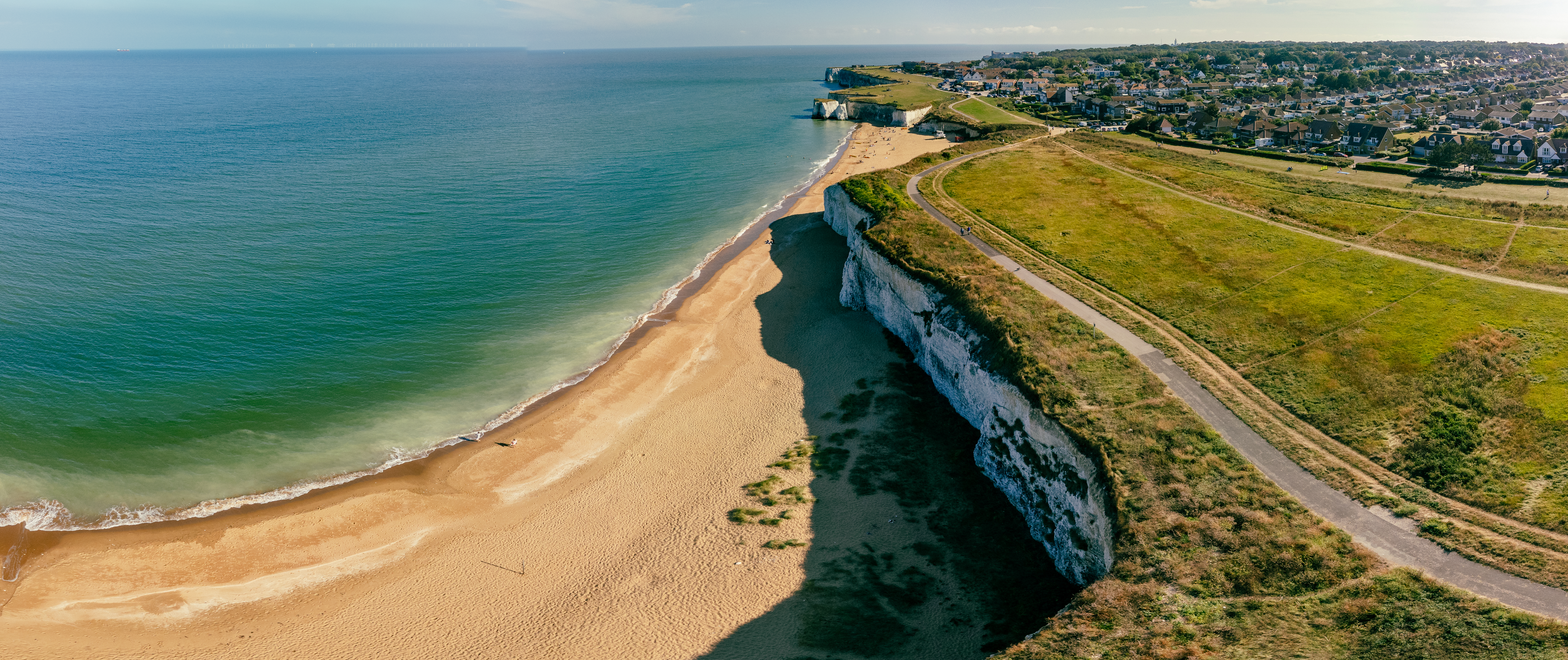 Drone aerial view of the beach and white cliffs, Botany Bay